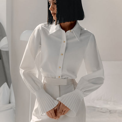 White slim-fit collared shirt with elegant bell sleeves. Perfect for a polished office look!